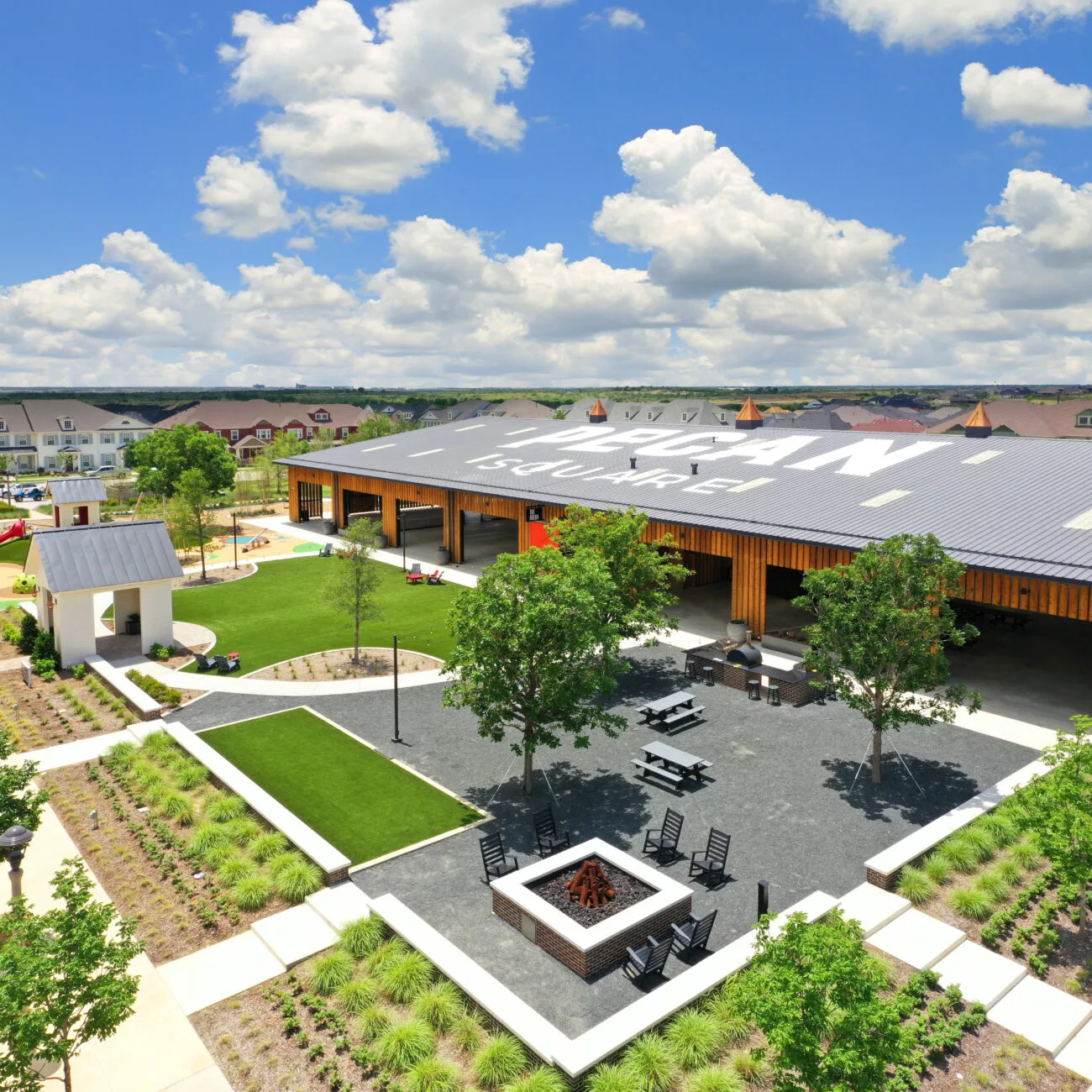 Aerial view of amenity space with outdoor gathering areas at Pecan Square in Northlake, Texas