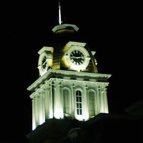 Historic clock tower illuminated at night in Indiana, PA