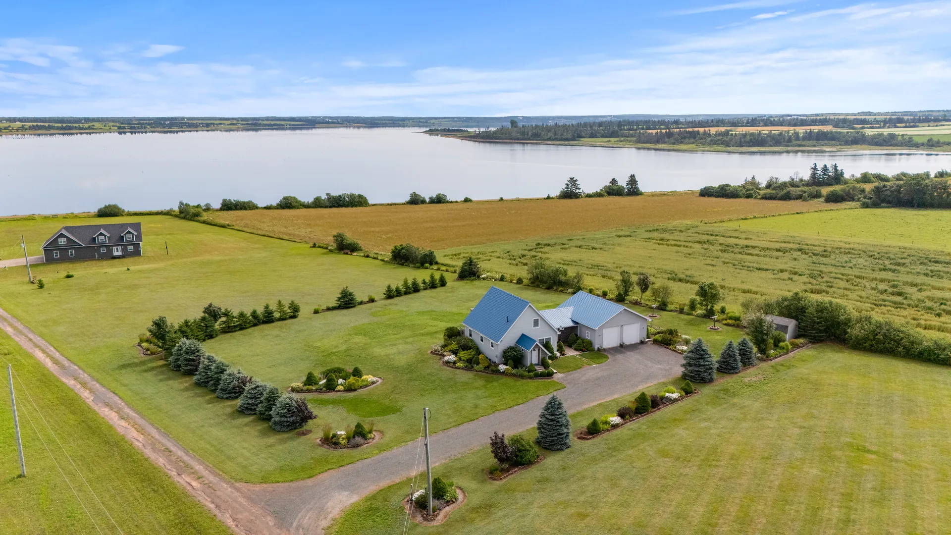 Aerial view of coastal property overlooking the bay