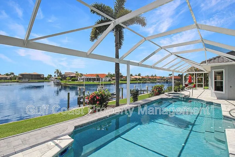 Pool and canal view from the backyard at 3415 Tripoli Blvd