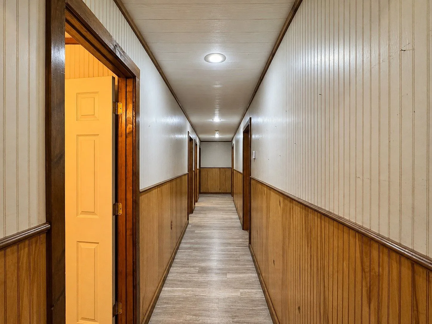 Interior hallway with wood wainscoting