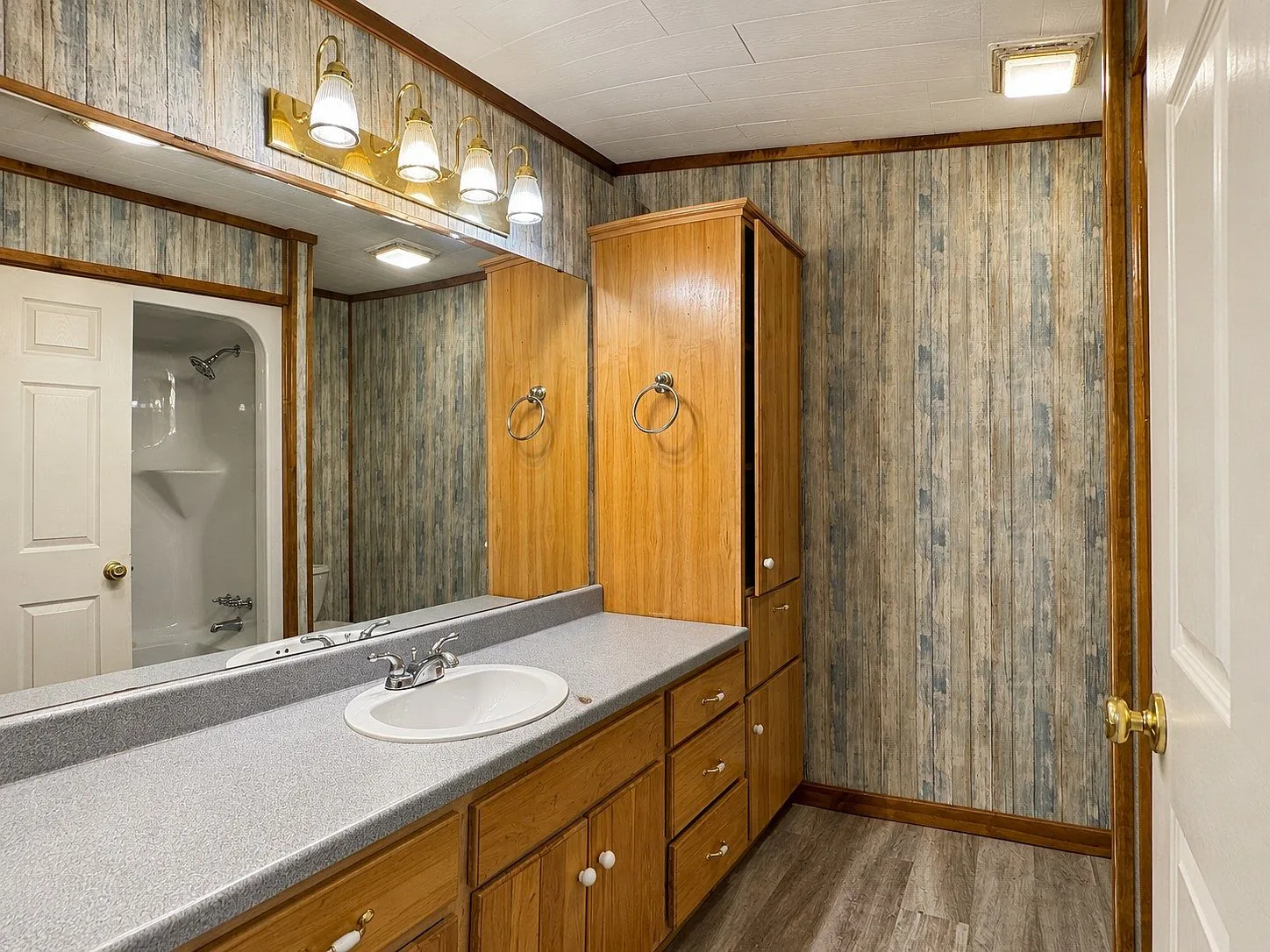 Bathroom vanity with rustic finishes