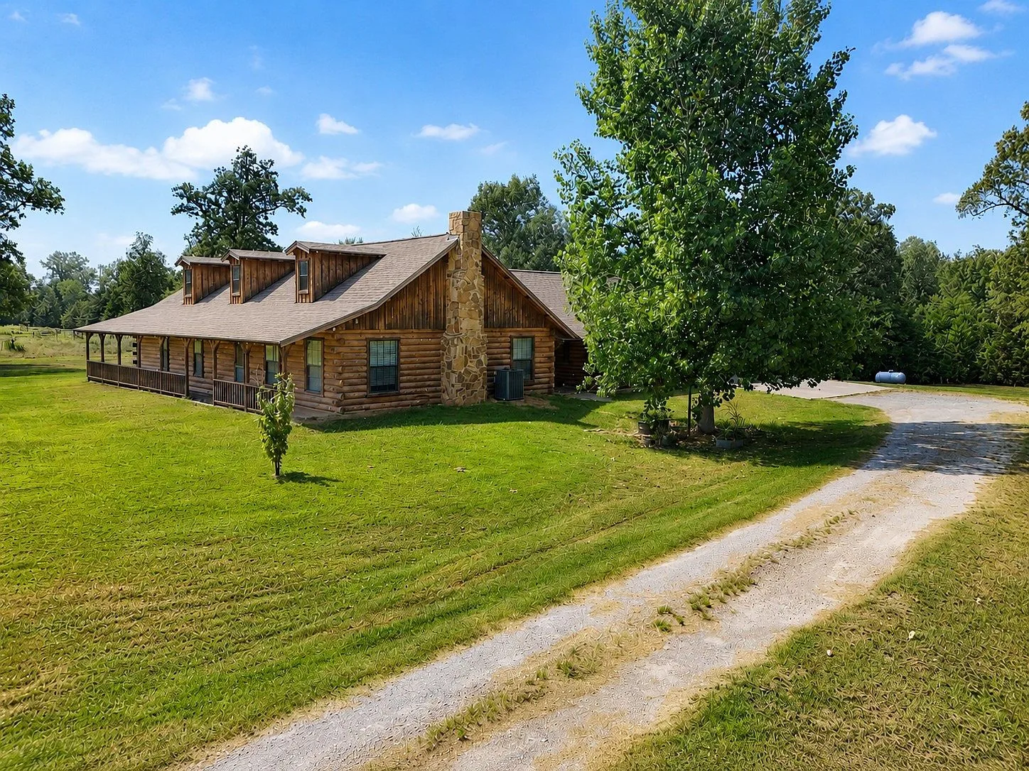 Elevated exterior view with gravel driveway