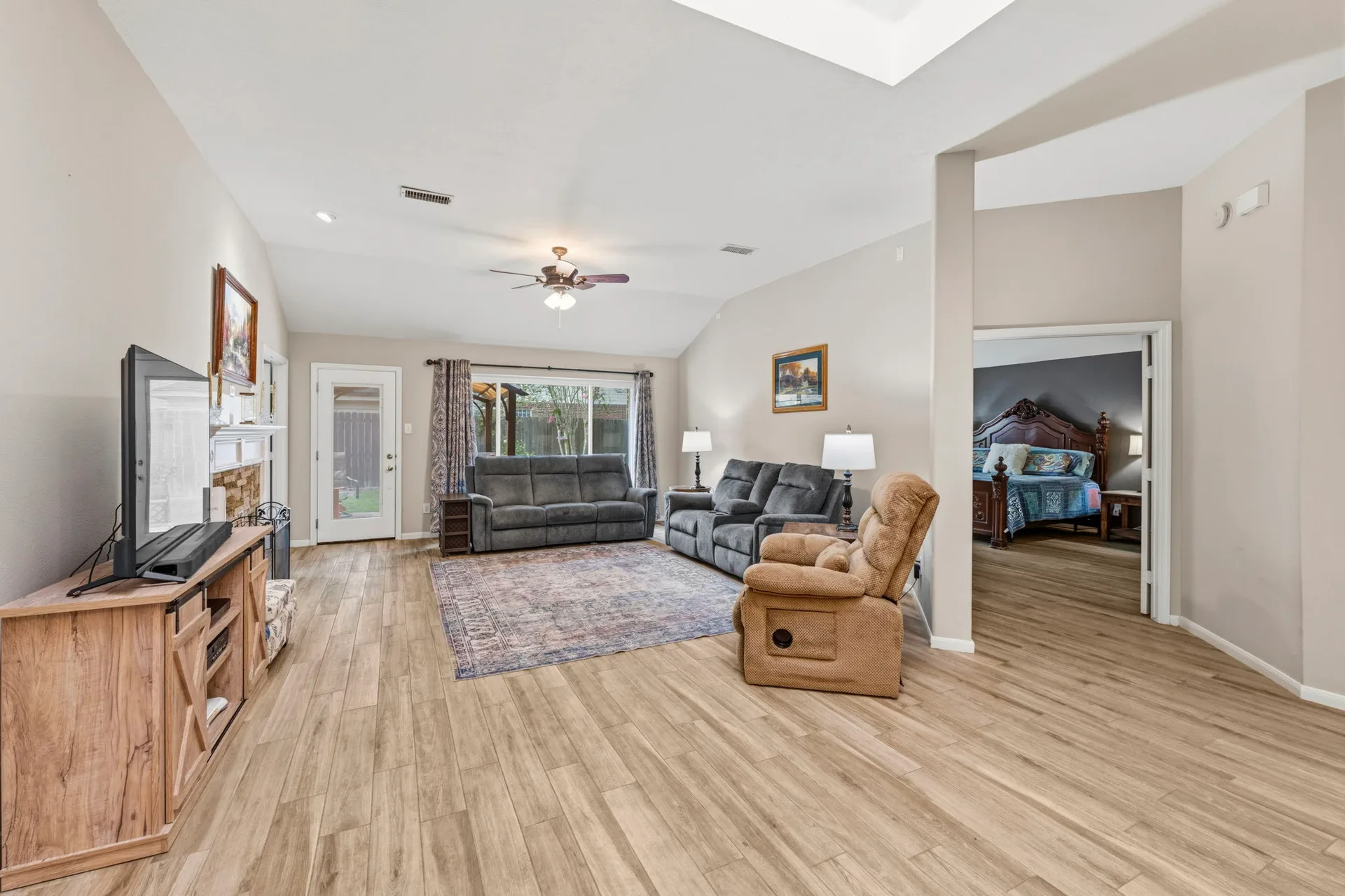 Spacious family room with vaulted ceilings and natural light