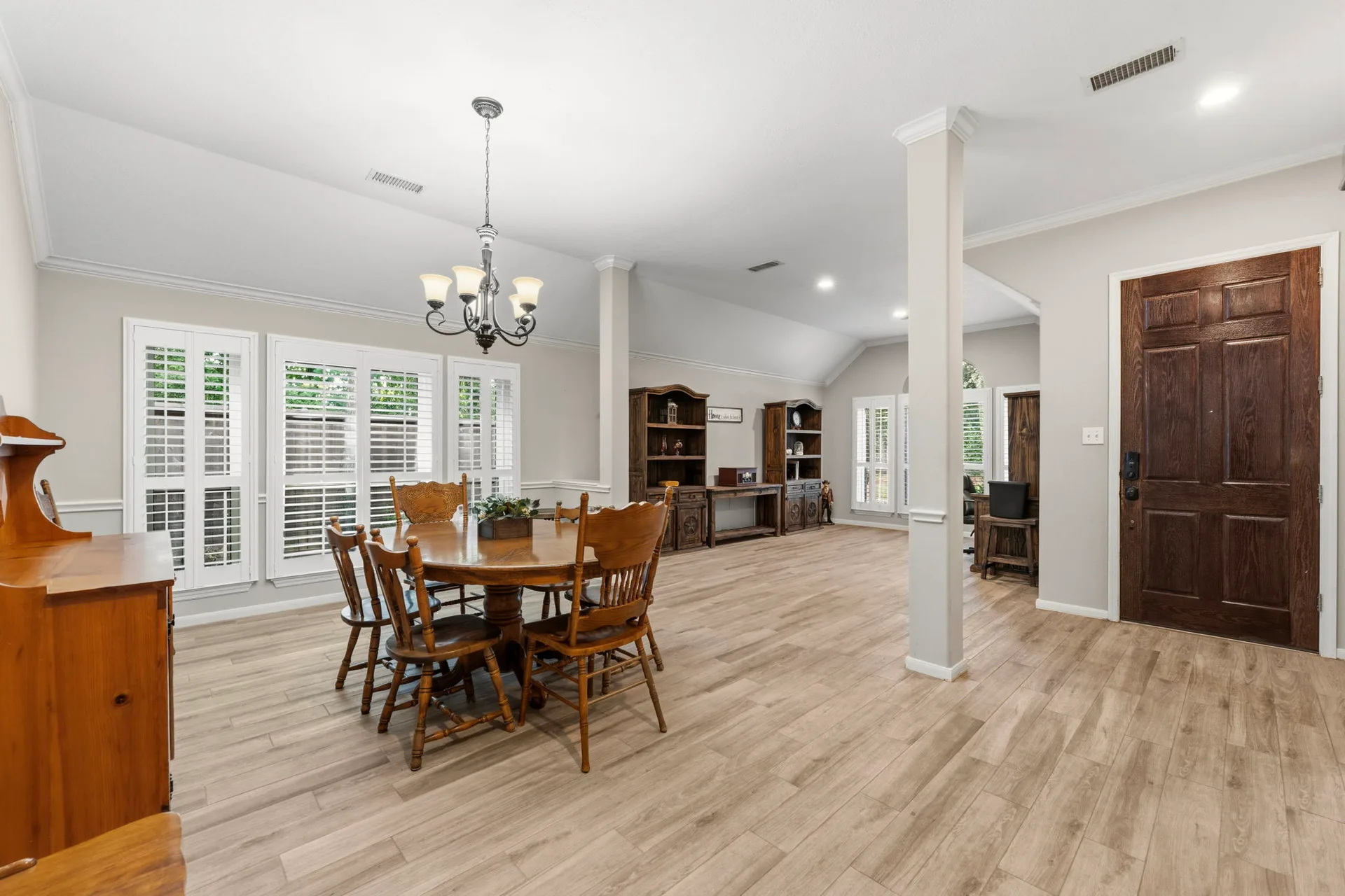 Dining room and entry view showing open layout and natural light