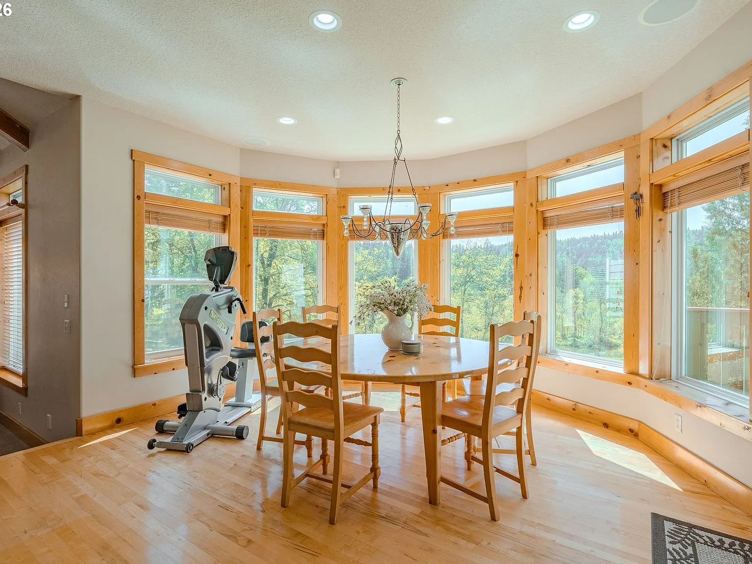 Breakfast nook with bay windows and natural wood trim, morning light