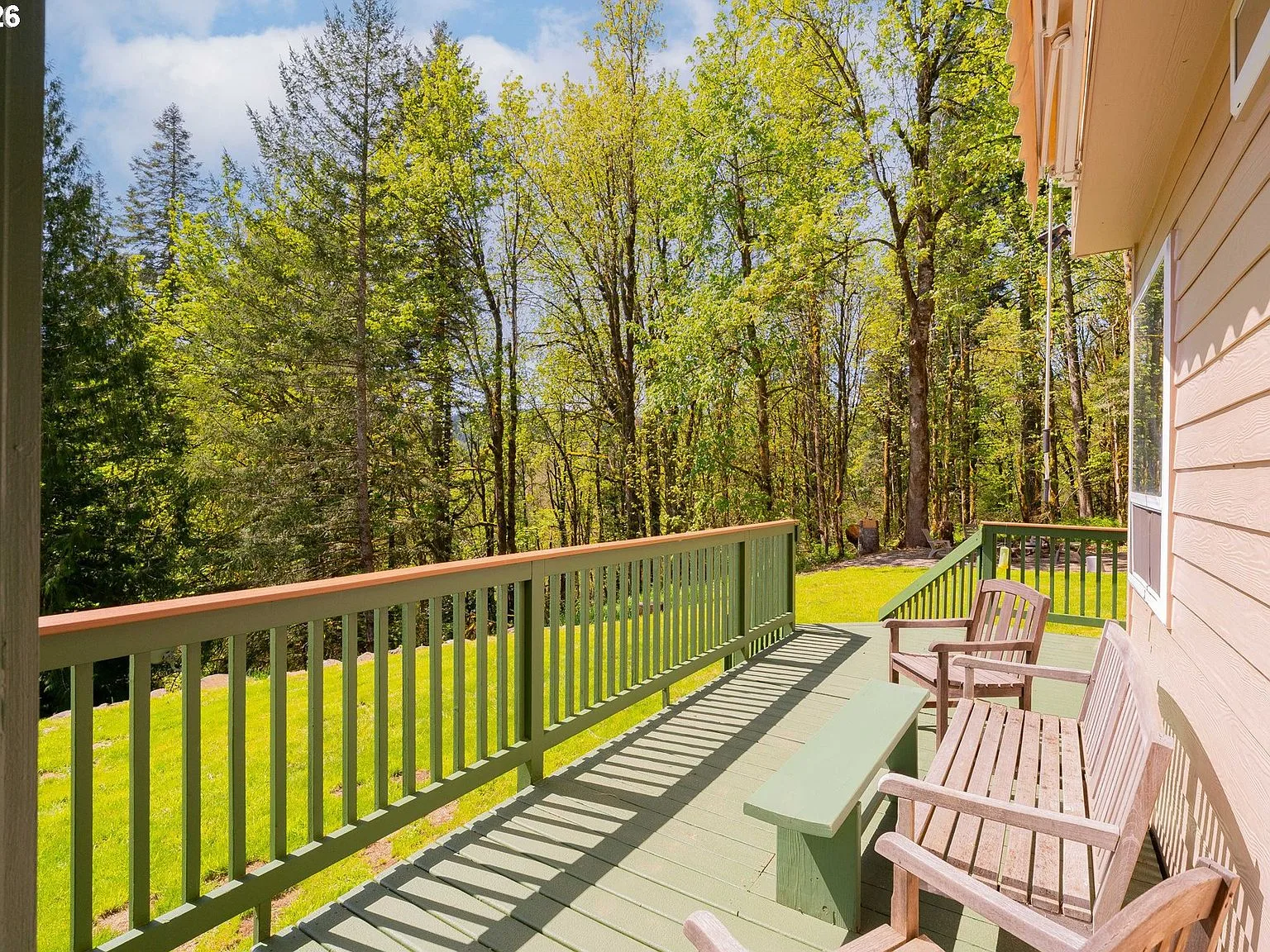 Wooden deck overlooking the trees behind the house