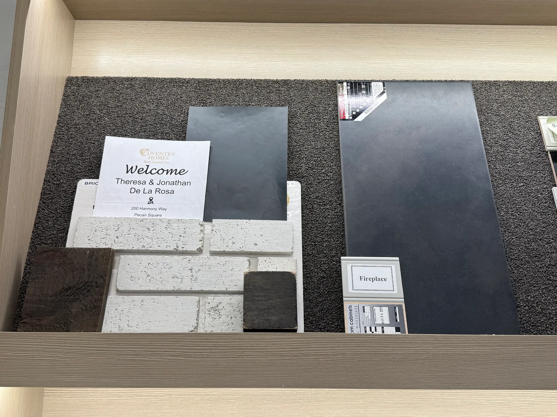 Design center finish samples for a new home build in Denton County, including brick veneer, flooring, and tile swatches