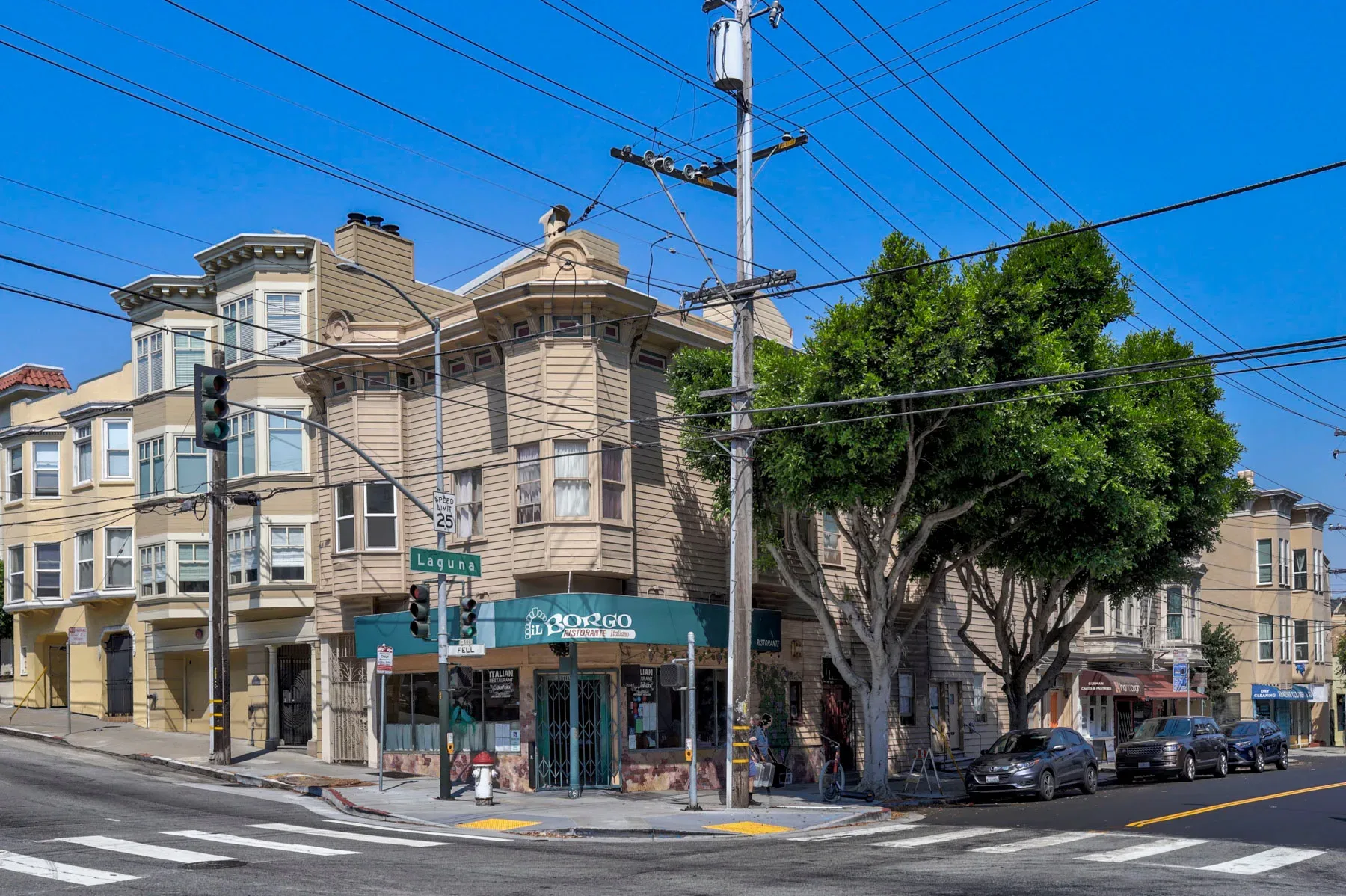 Corner property with restaurant storefront and Victorian architecture