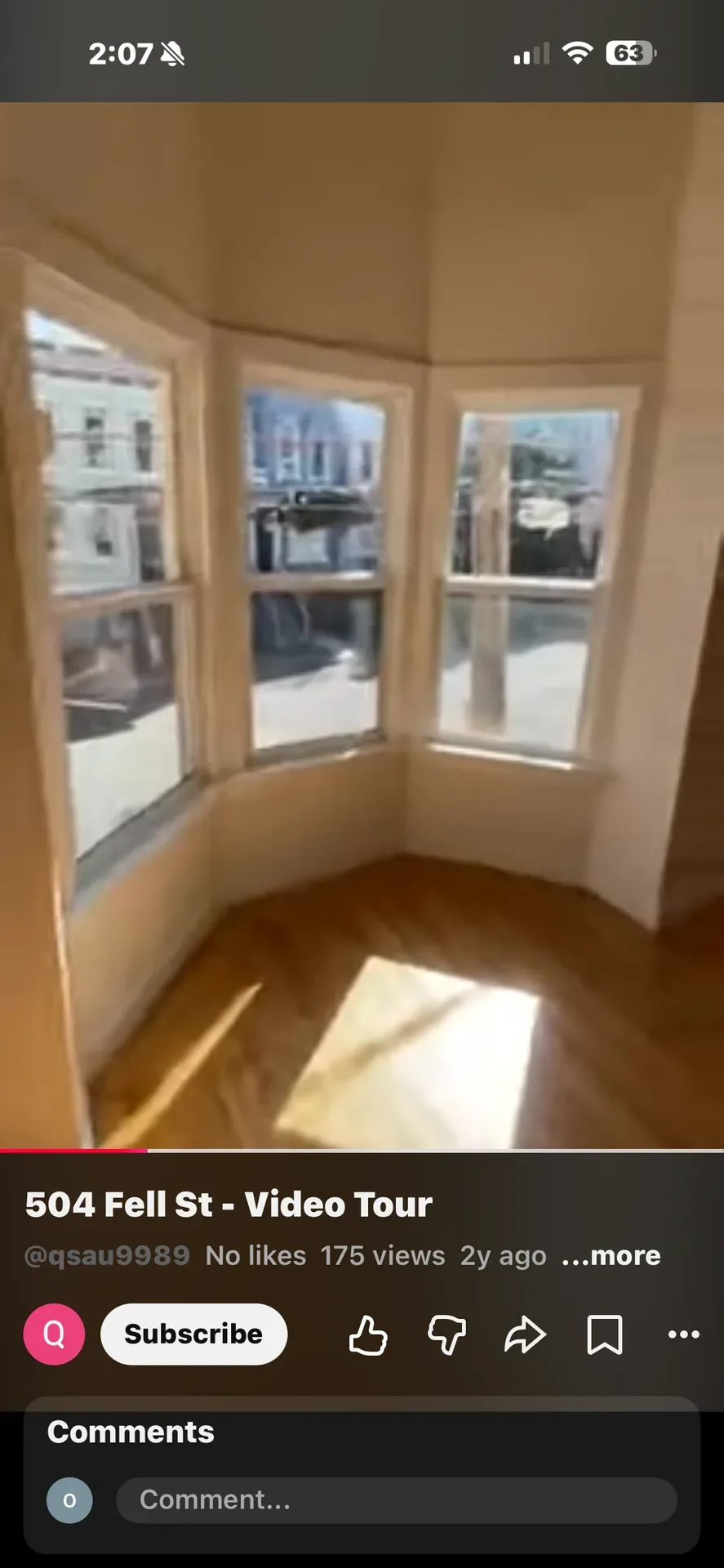 Vacant bay window living room with hardwood floors and natural light