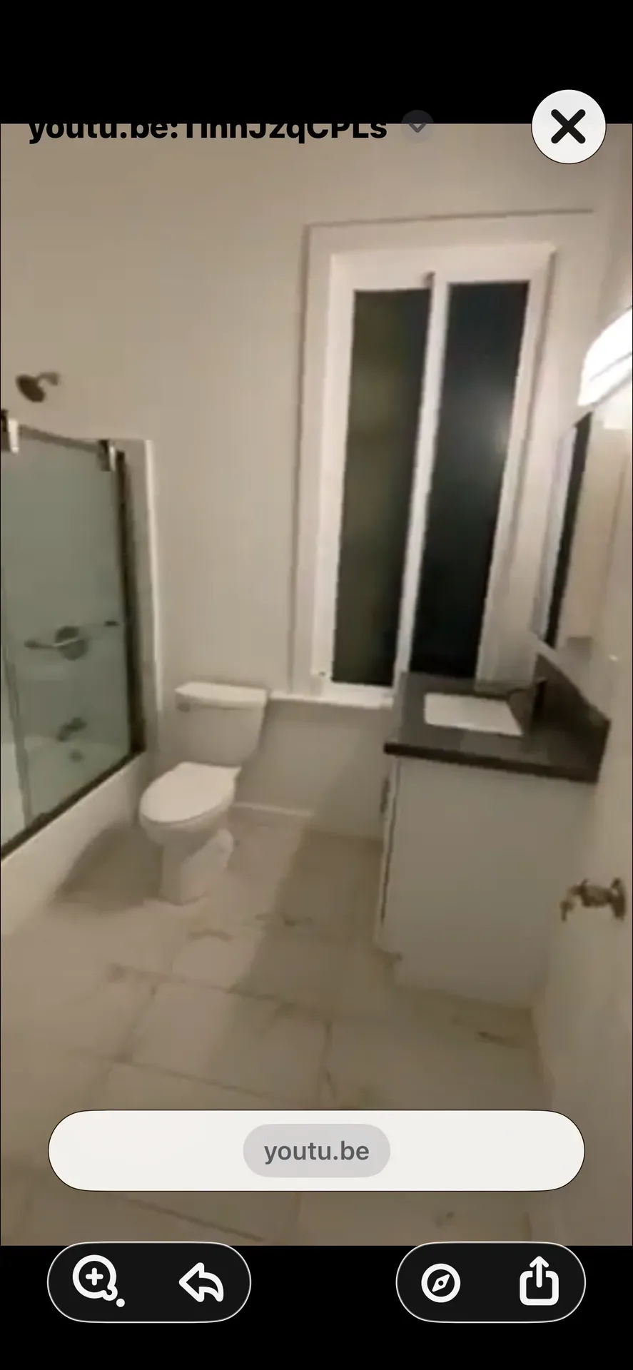Updated bathroom with vanity, dark countertop, and glass-enclosed shower