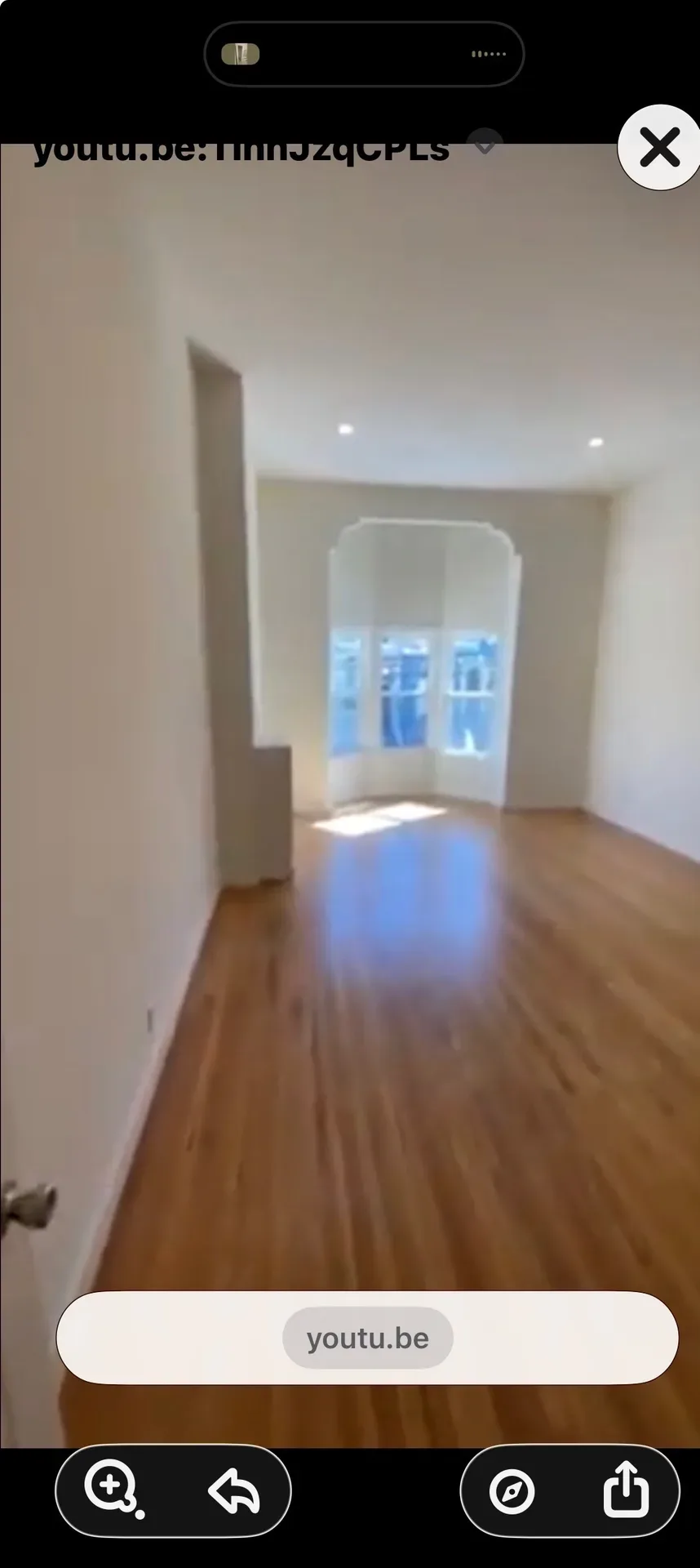 Residential unit with hardwood floors and classic bay window