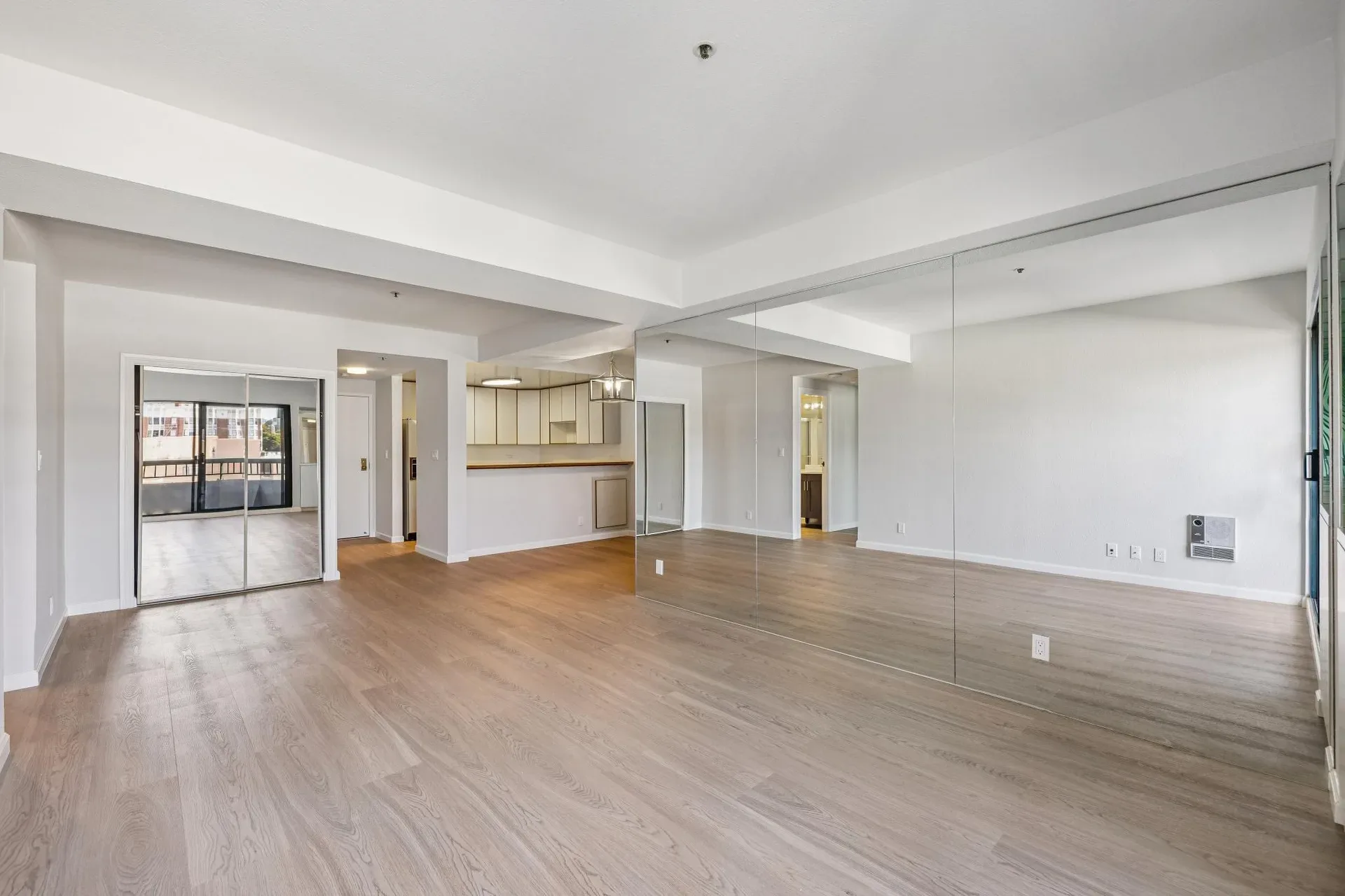 Open concept living area with kitchen at Opera Plaza condo