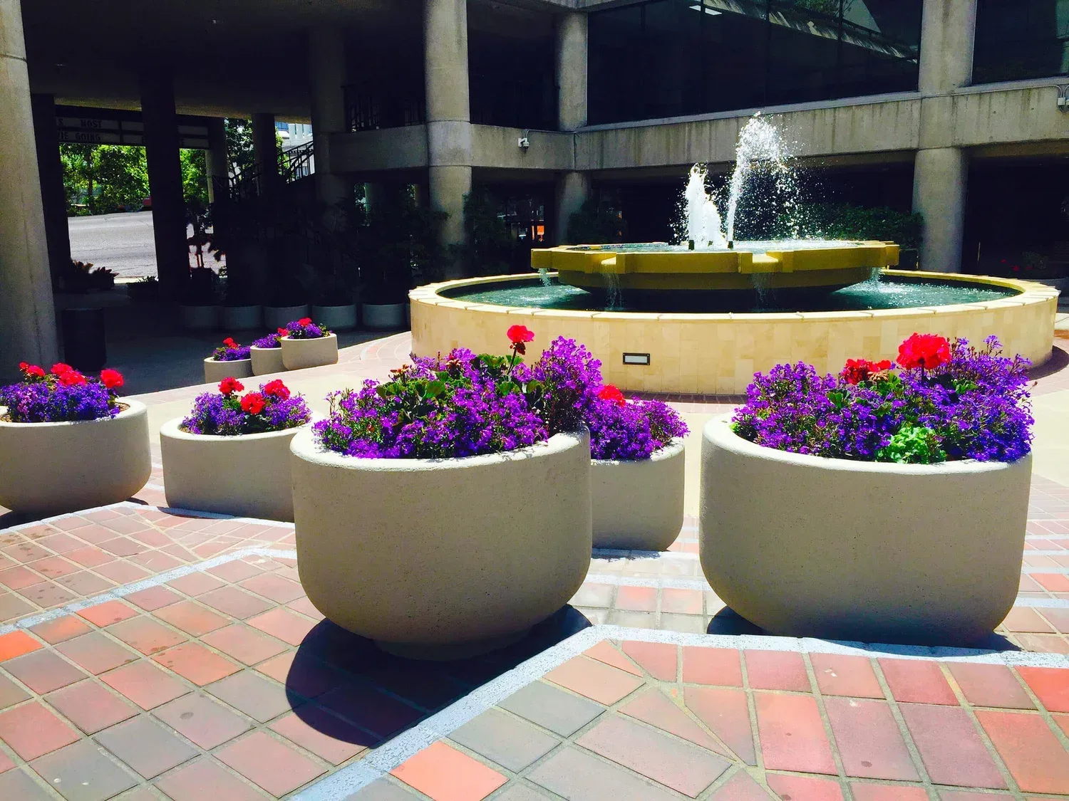 Opera Plaza courtyard with fountain and landscaped planters