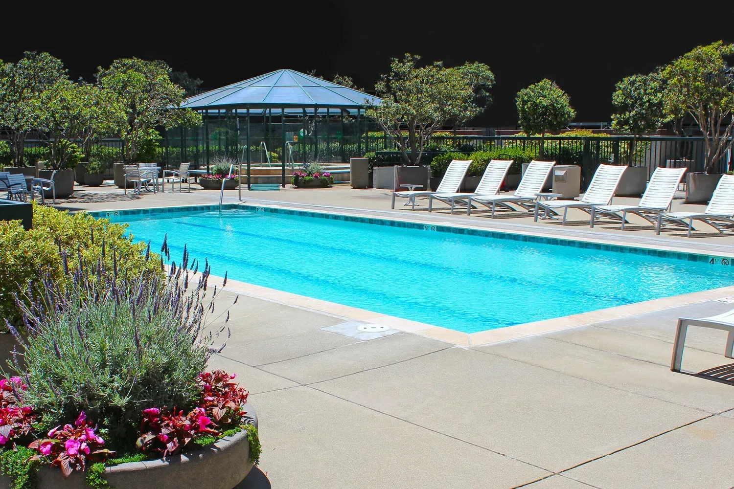 Opera Plaza swimming pool with lounge chairs and gazebo