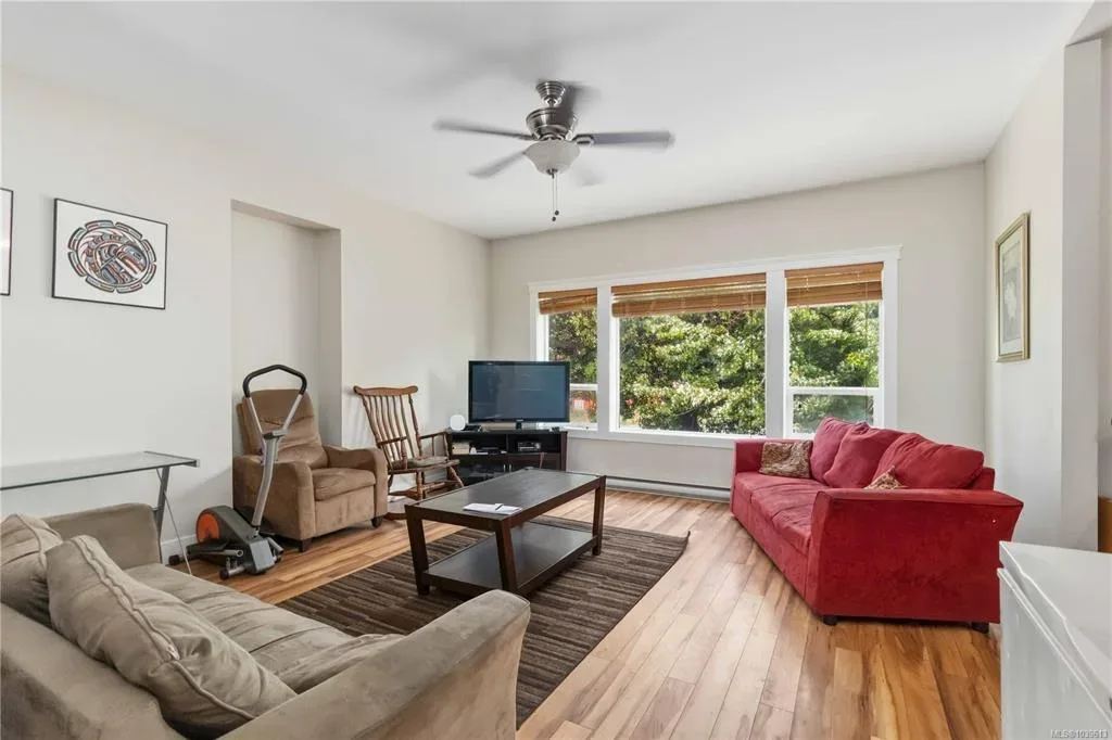 Main-floor living area shown with existing furnishings and tenant items