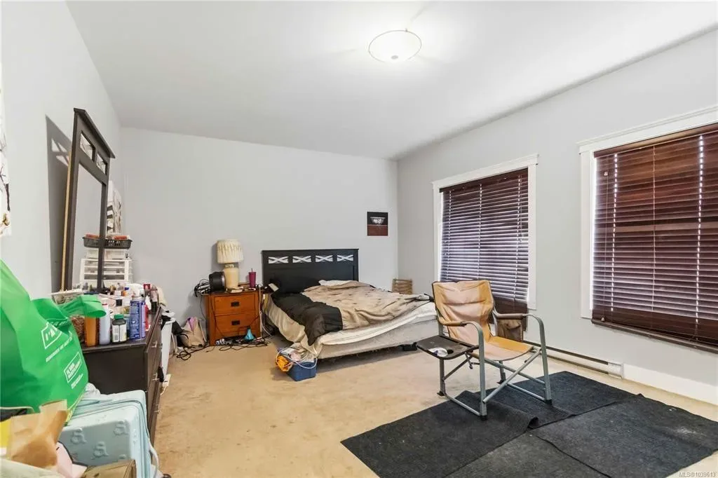 Primary bedroom shown as currently occupied with existing furnishings
