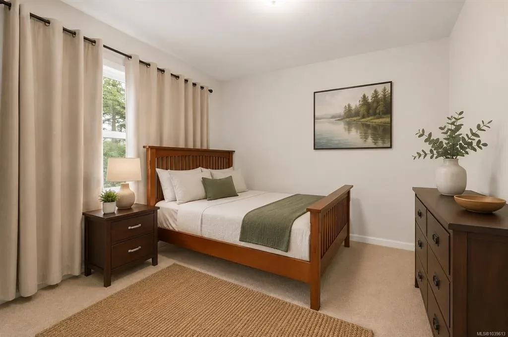 Additional bedroom with beige walls, carpet, and conventional layout
