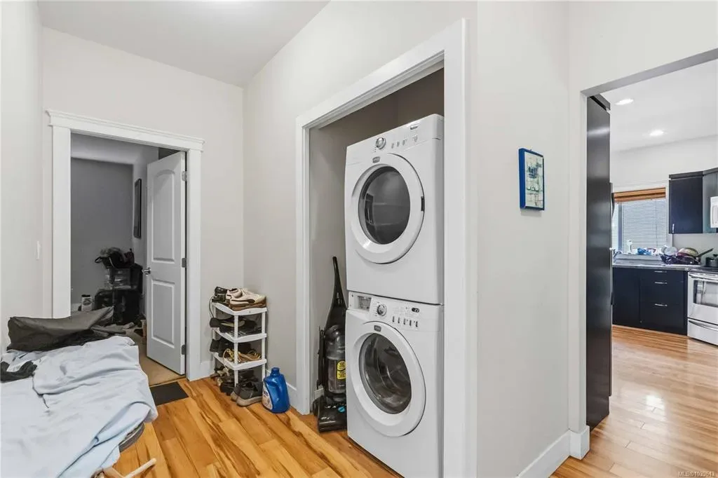 Main-floor laundry nook with stacked washer and dryer