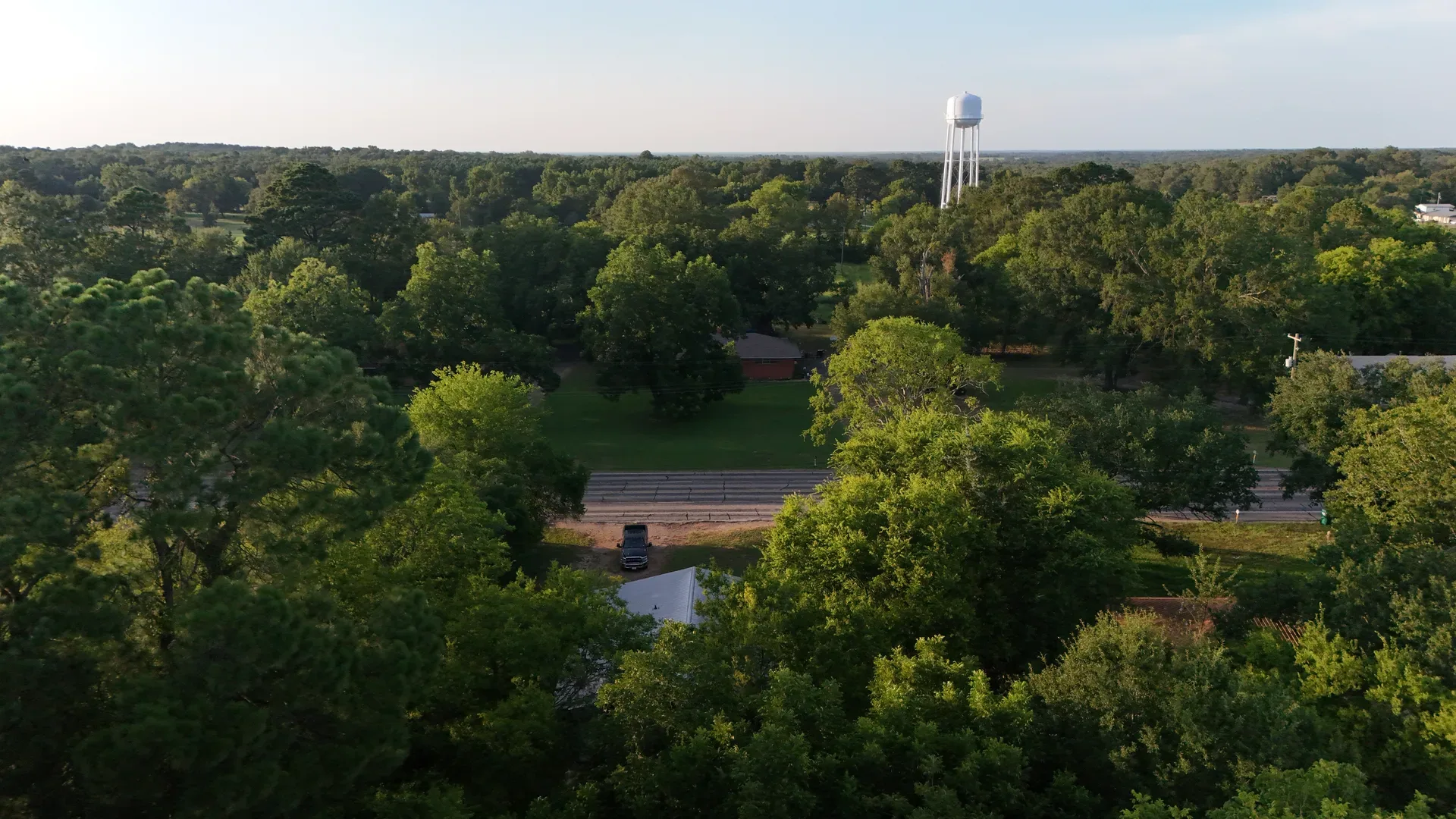 Drone aerial view of the property and surrounding Omaha Texas neighborhood