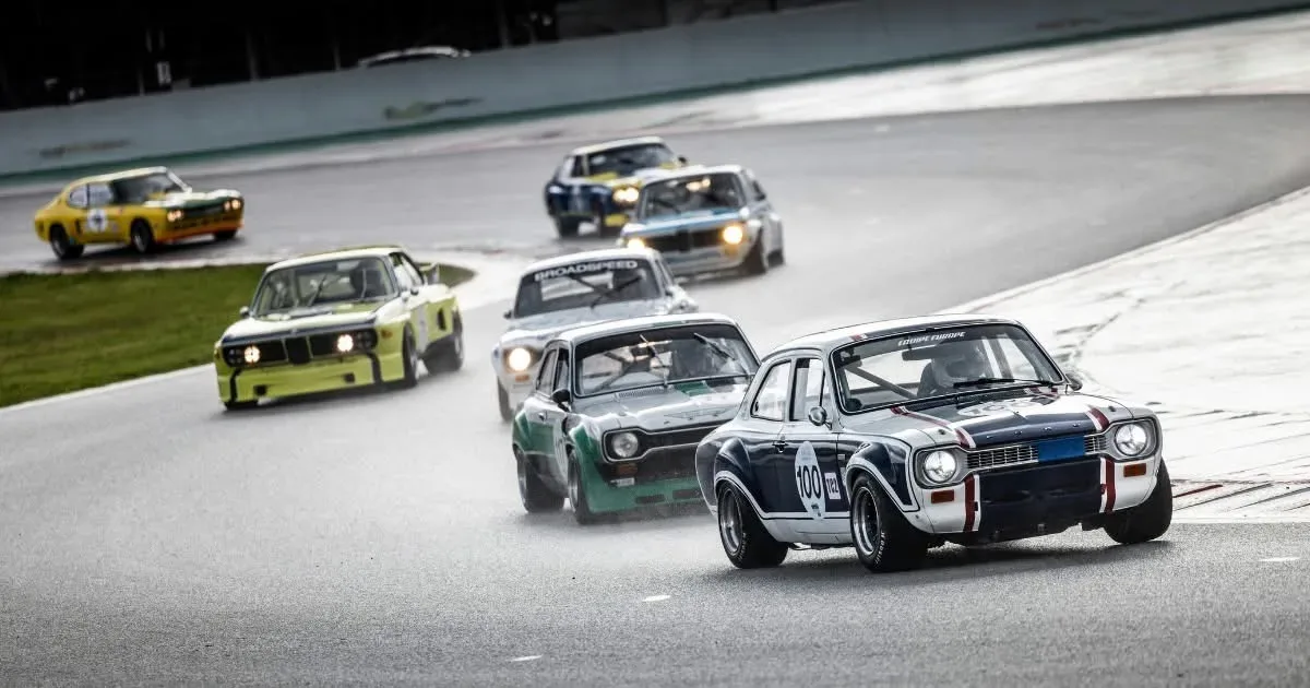 Vintage race cars competing on a track near Braselton Georgia during a historic racing event