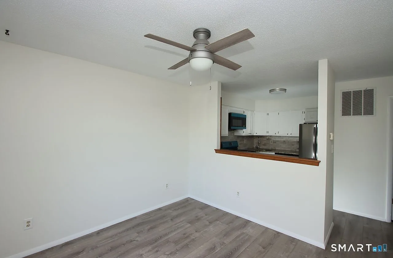 View from living room into the kitchen with pass-through opening