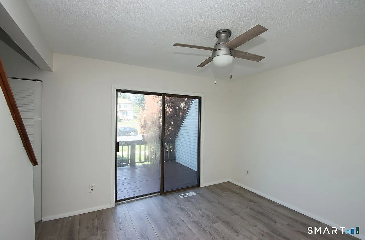 Living room with sliding glass doors leading to the deck