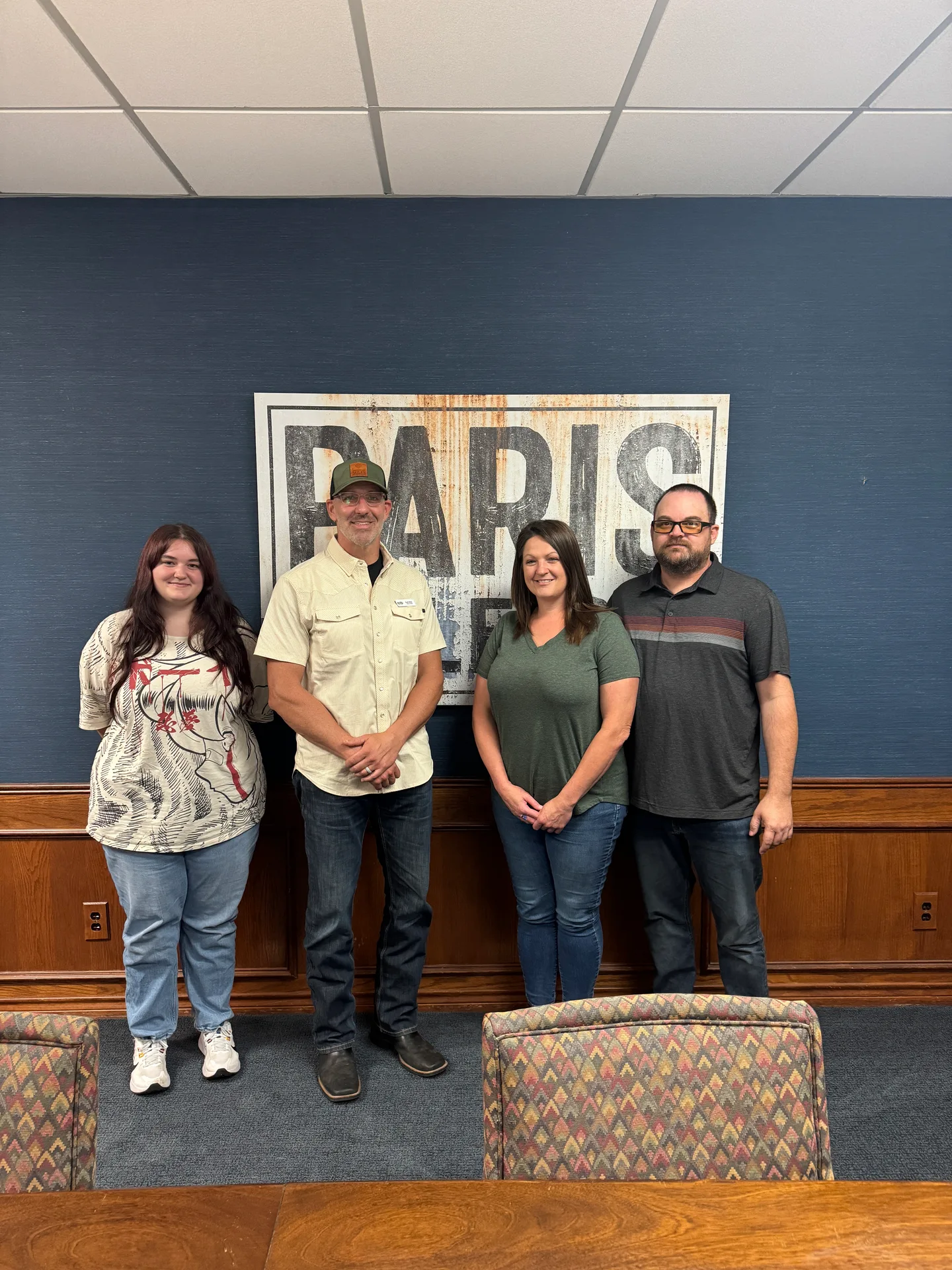 The Shannon Miles Group team and a family celebrating a closing in their Paris, Texas office
