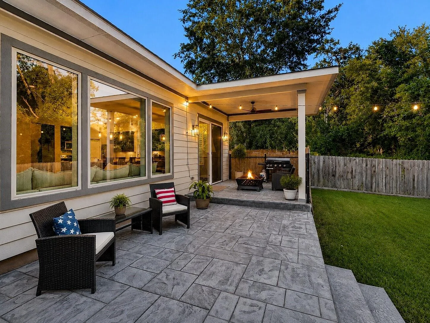 Covered patio overlooking the fully fenced backyard