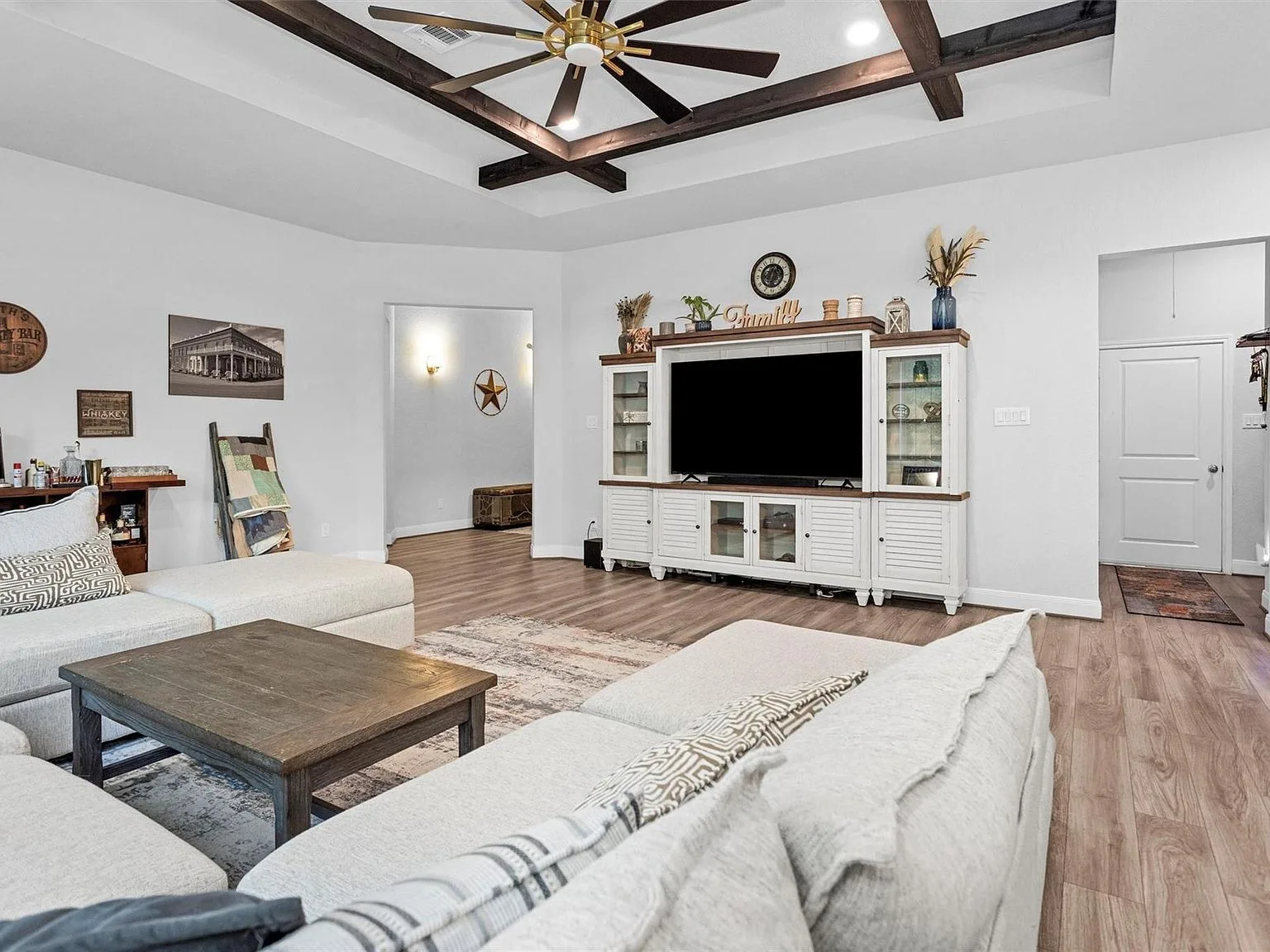 Living room with vaulted ceiling and wood beams