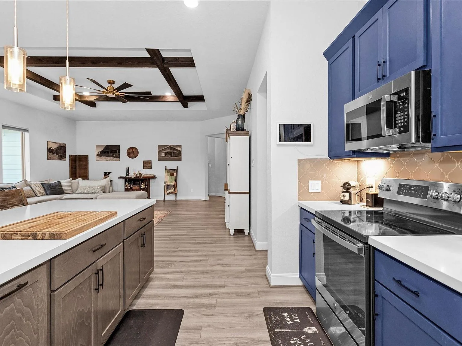 Kitchen view into open-concept living area
