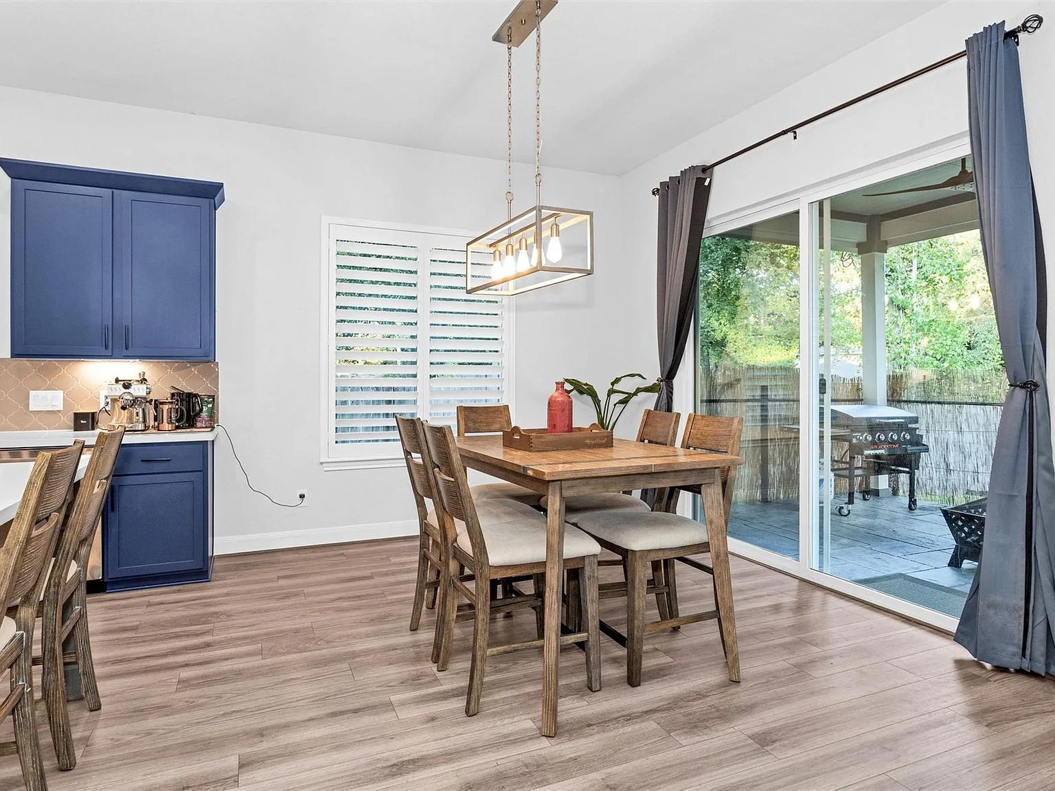 Dining area with navy accents and plantation shutters