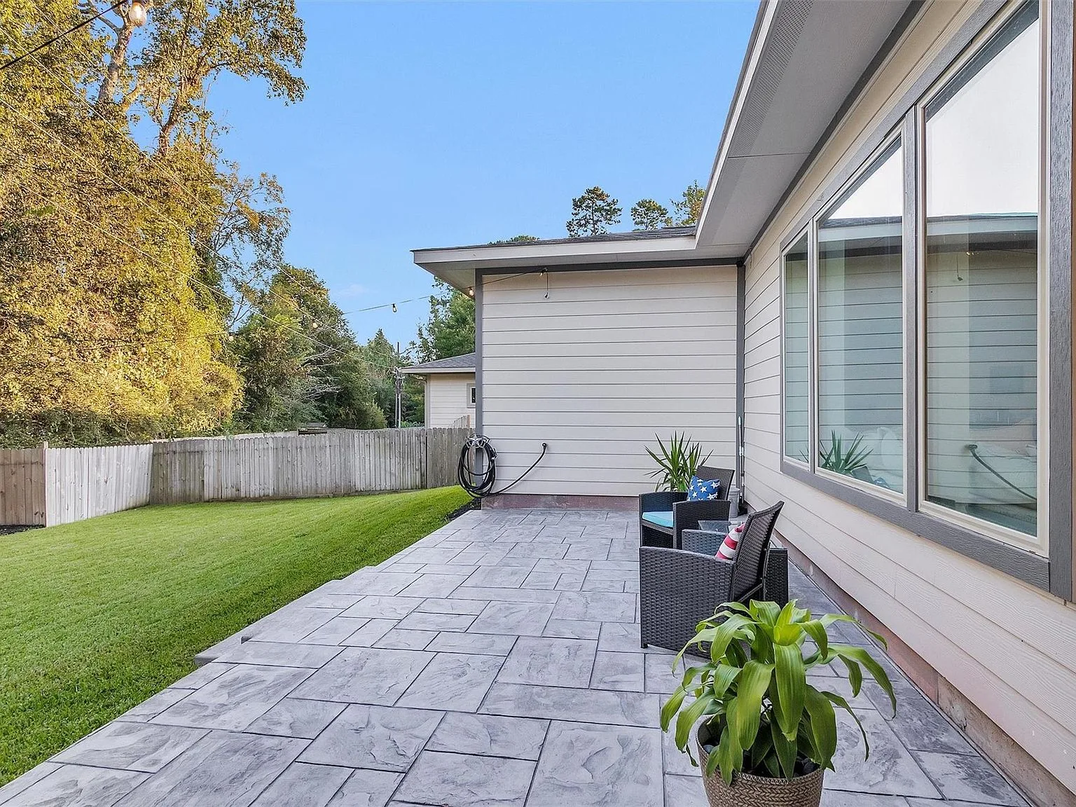 Backyard with stamped concrete patio