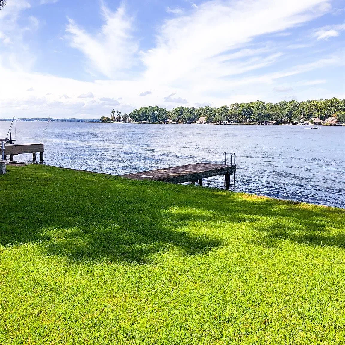 Community lakefront green space with pier on Lake Conroe