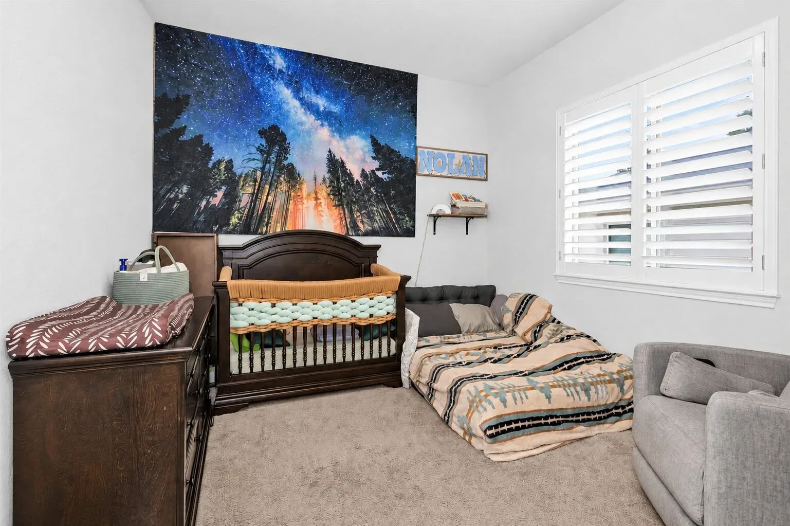 Fourth bedroom used as a nursery with plantation shutters