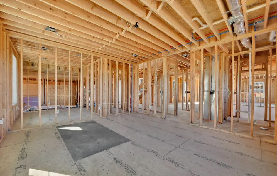 Interior framing with wood studs and subfloor visible