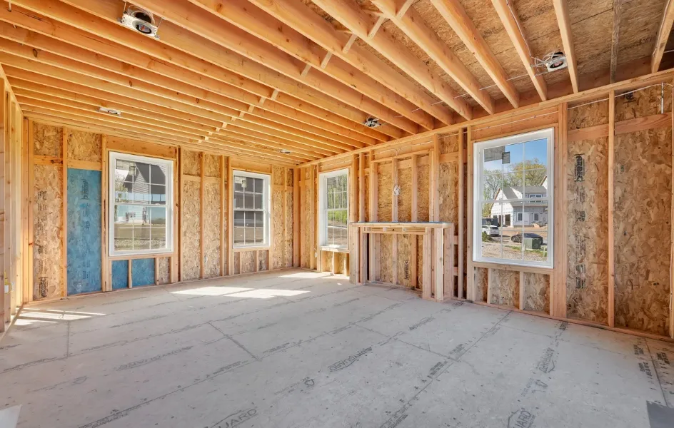 Unfinished living room with fireplace framing during construction