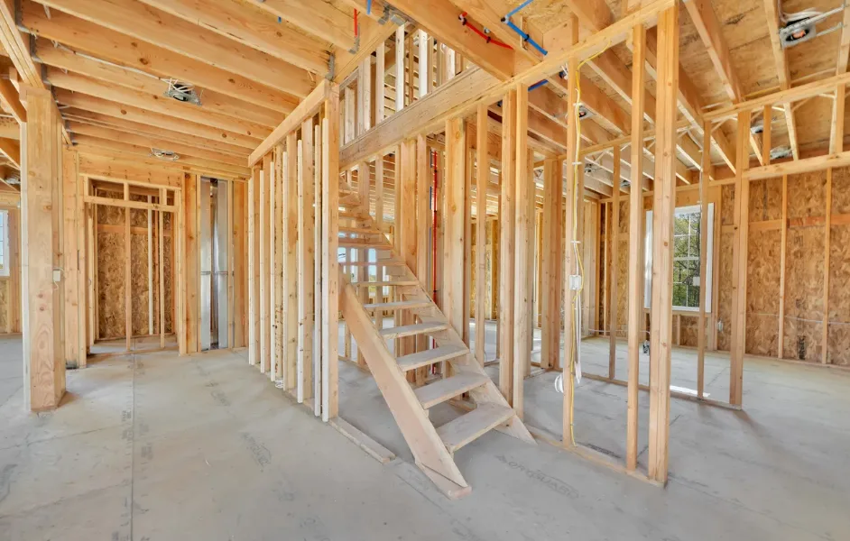 Framing and staircase during construction of colonial home