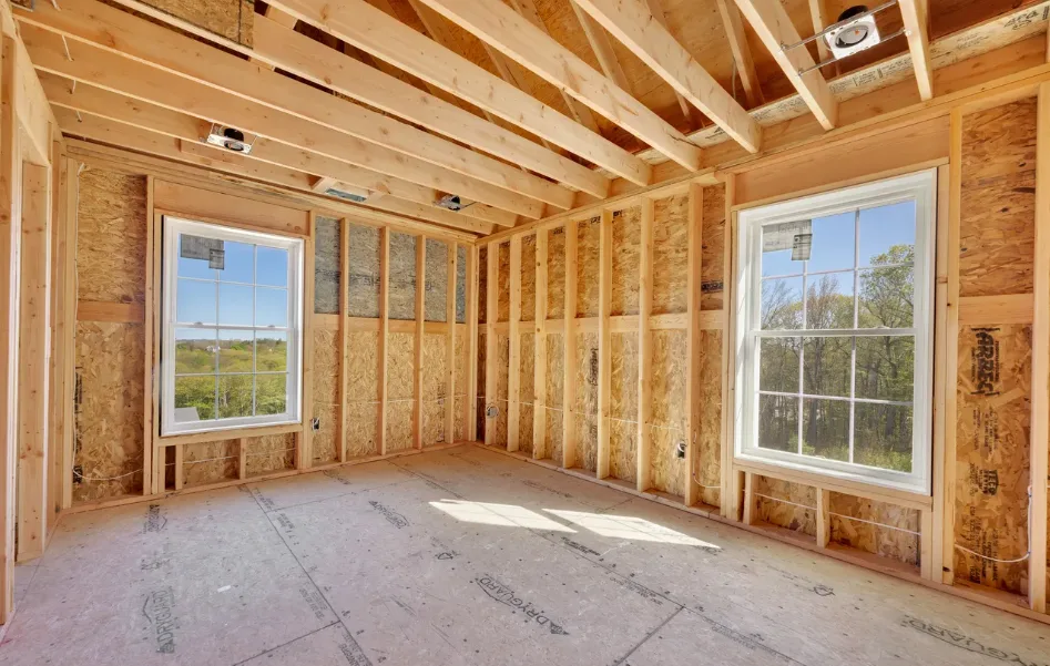 Bedroom under construction with recessed lighting housings installed