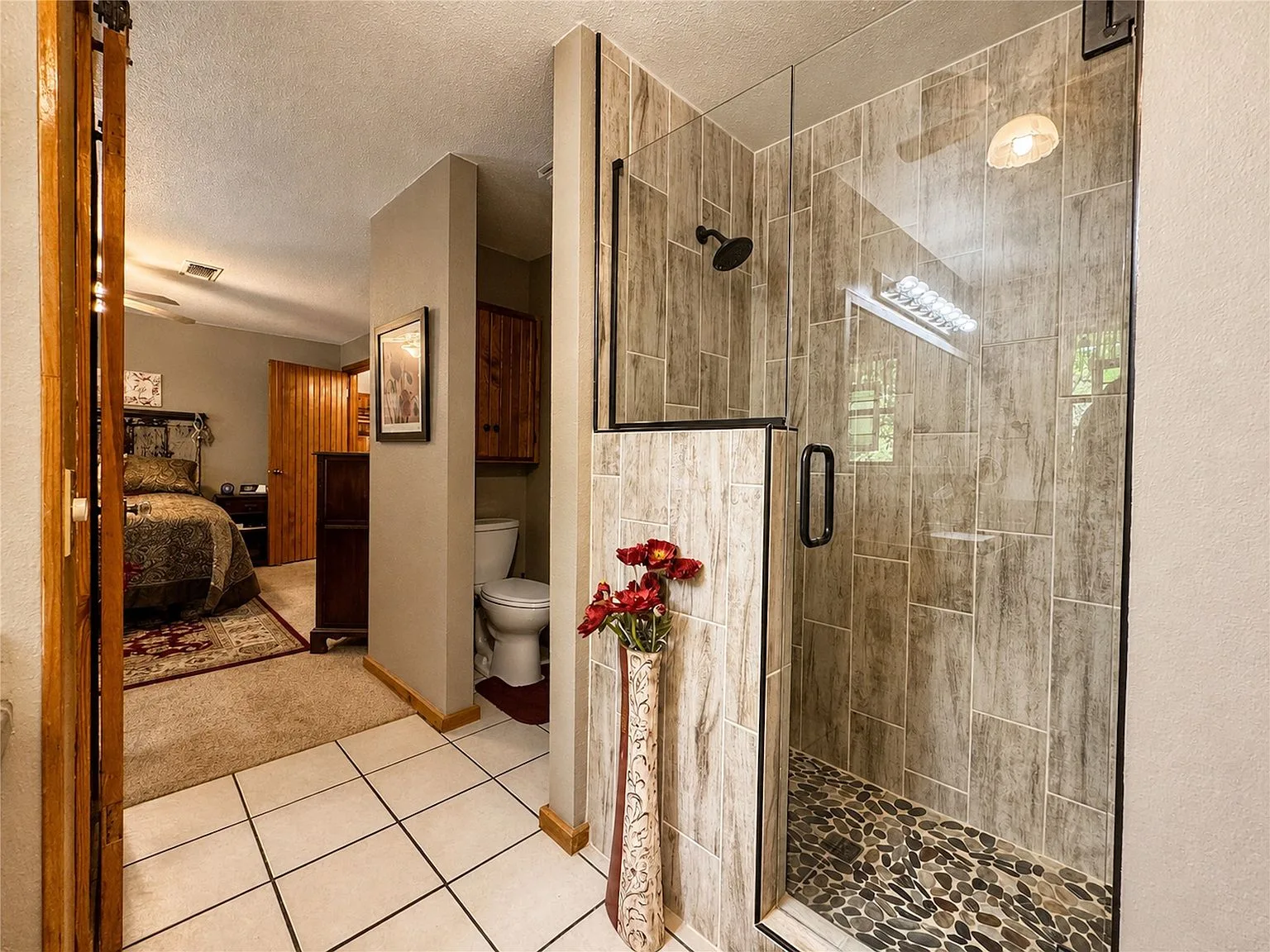 Updated bathroom with walk-in shower and glass enclosure