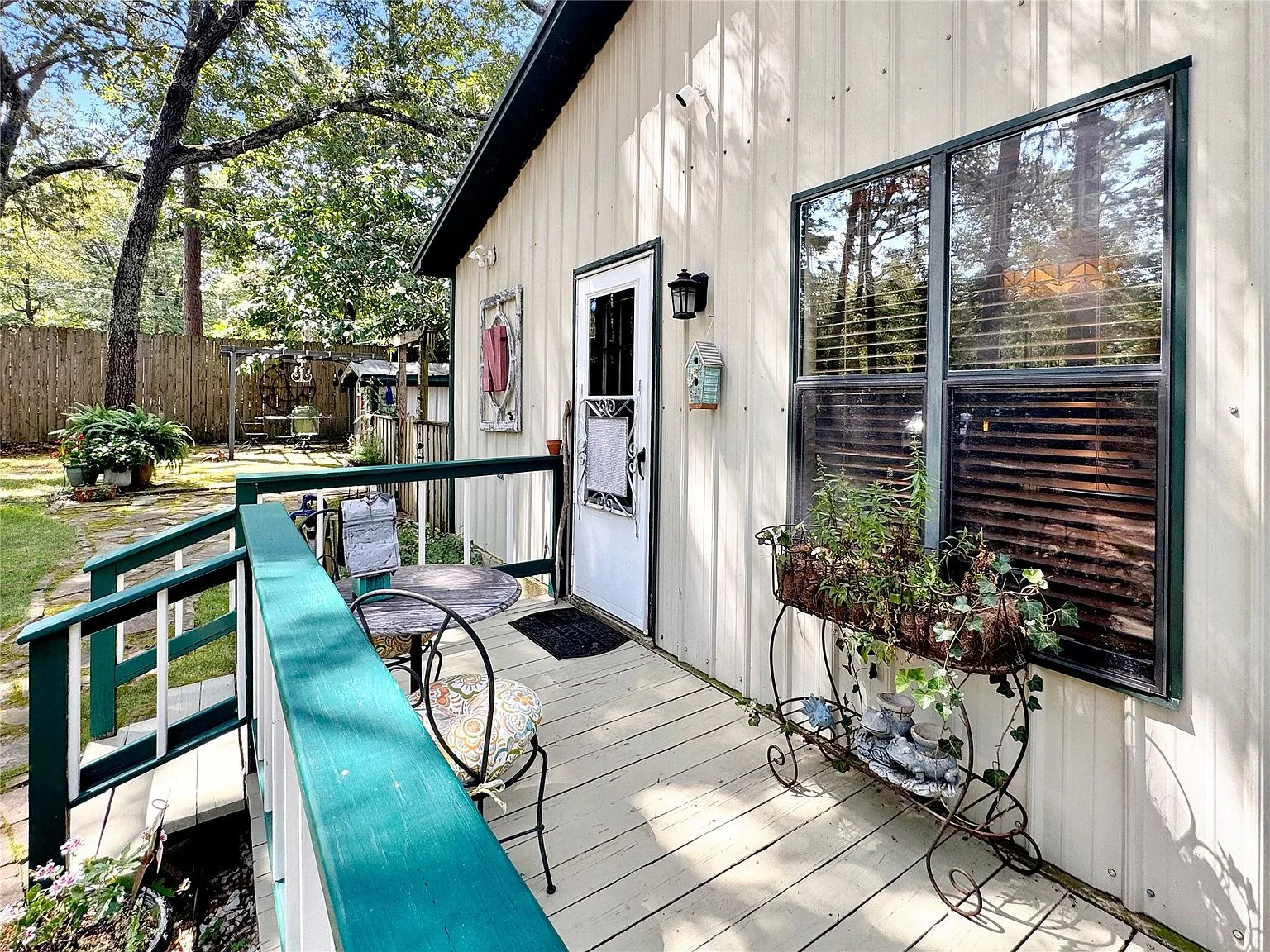 Ground-level covered porch entry with board-and-batten siding