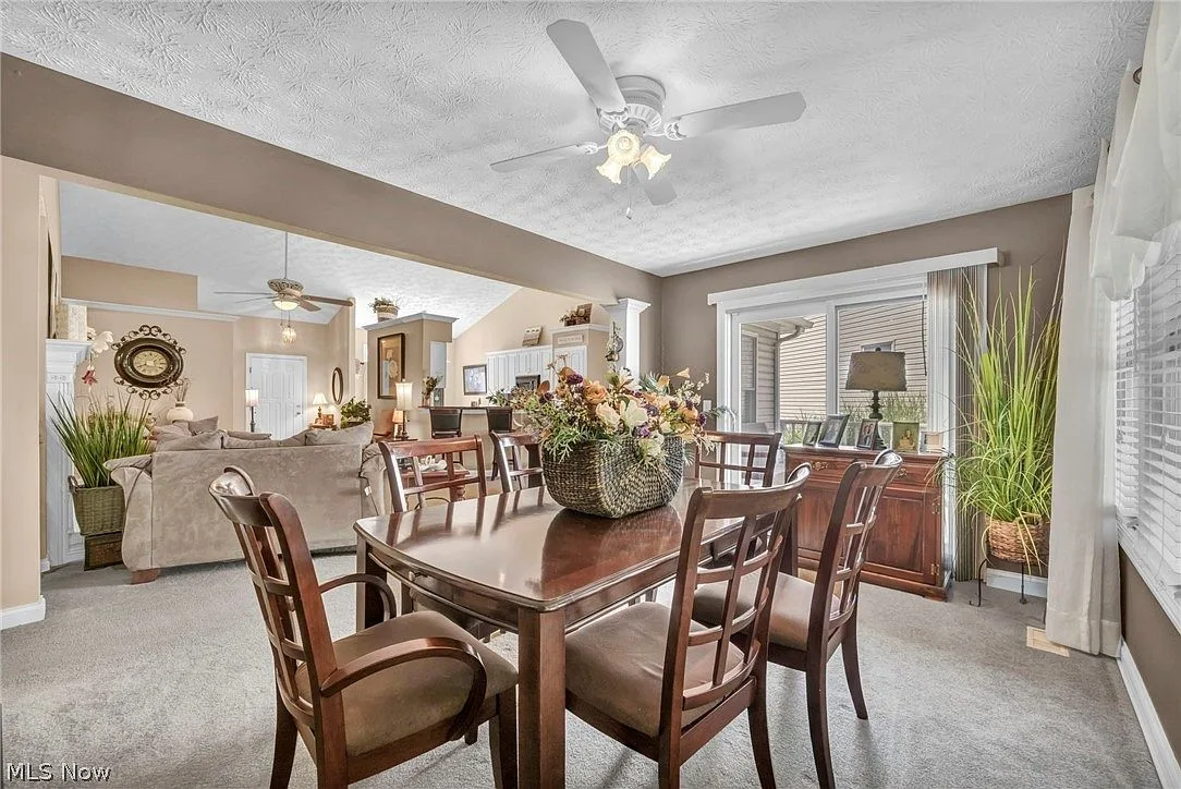 Dining room with open floor plan view into living area