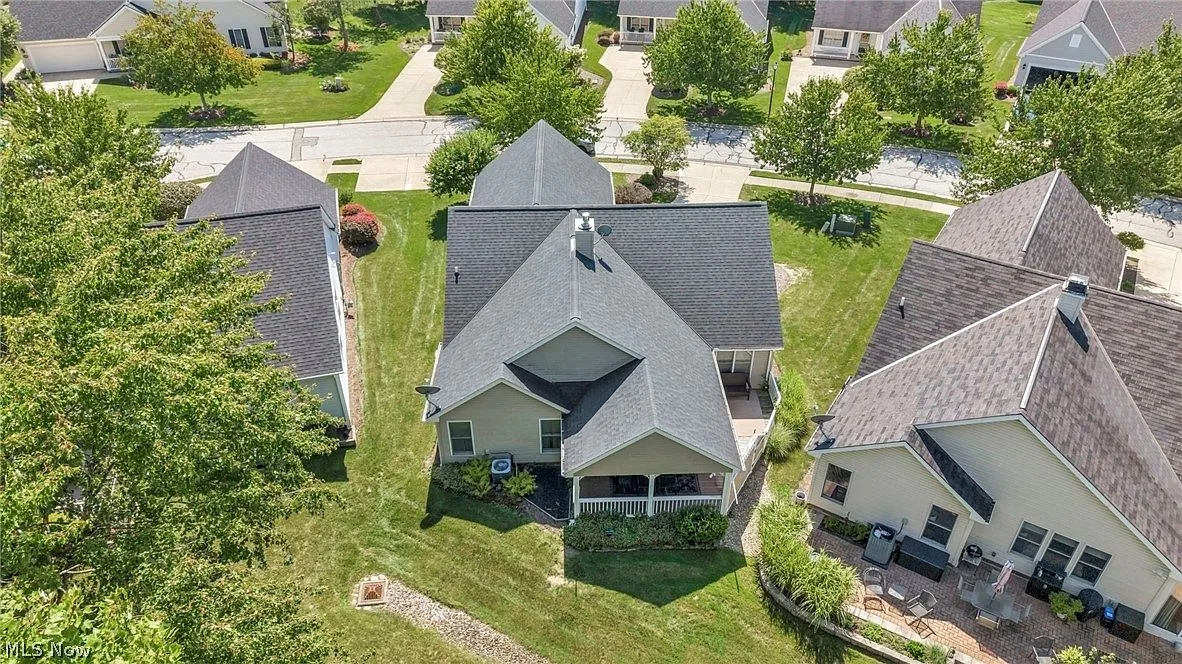 Aerial view showing covered patio and landscaping