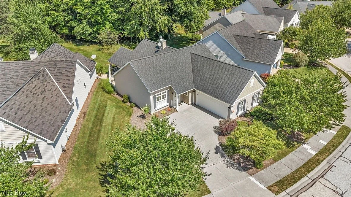 Aerial view of ranch cluster showing driveway and entrance