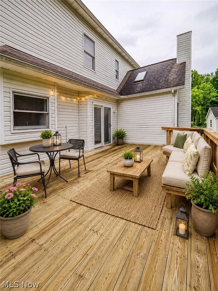 Backyard deck with string lights and outdoor living space
