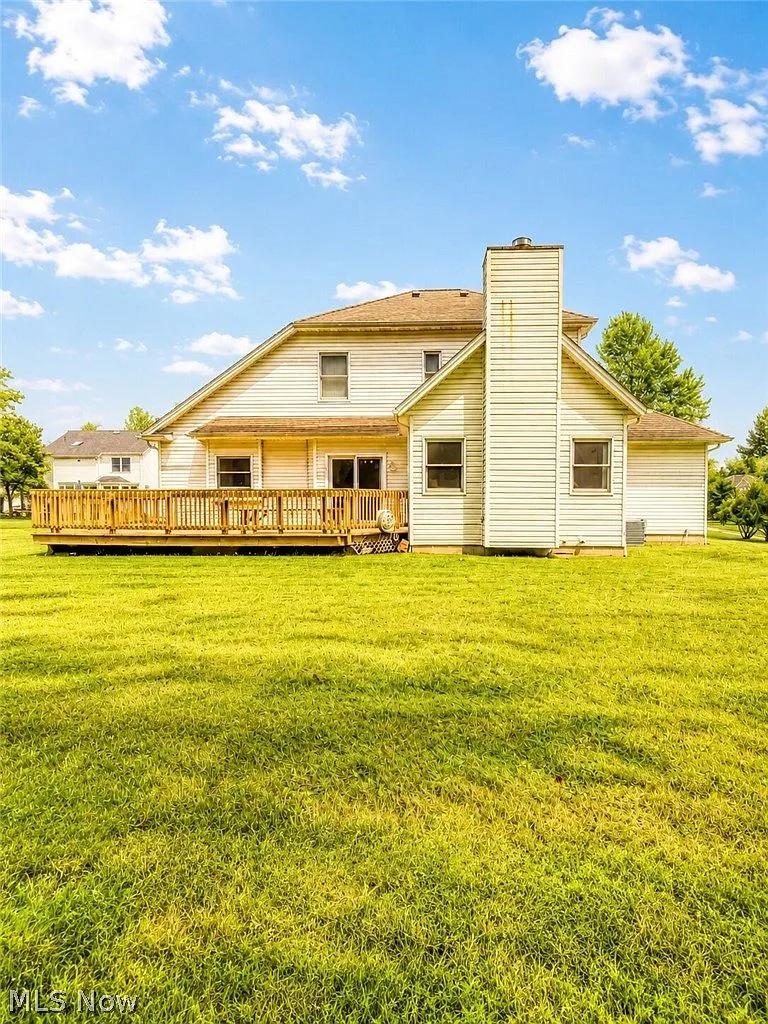 Rear deck with mature trees in the background