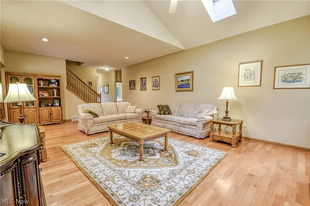 Family room showing vaulted ceiling and skylights from another angle