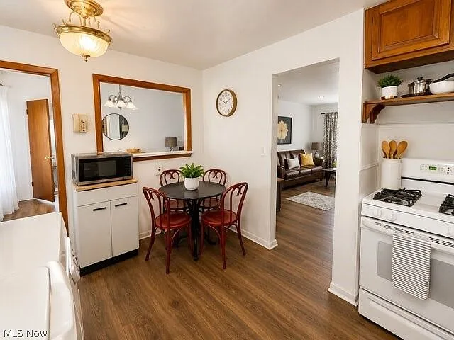 Kitchen with white cabinets and dining space