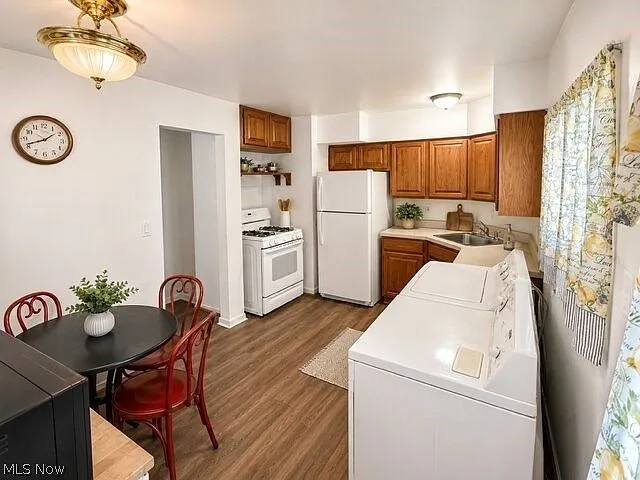 Kitchen and dining area with wood cabinetry