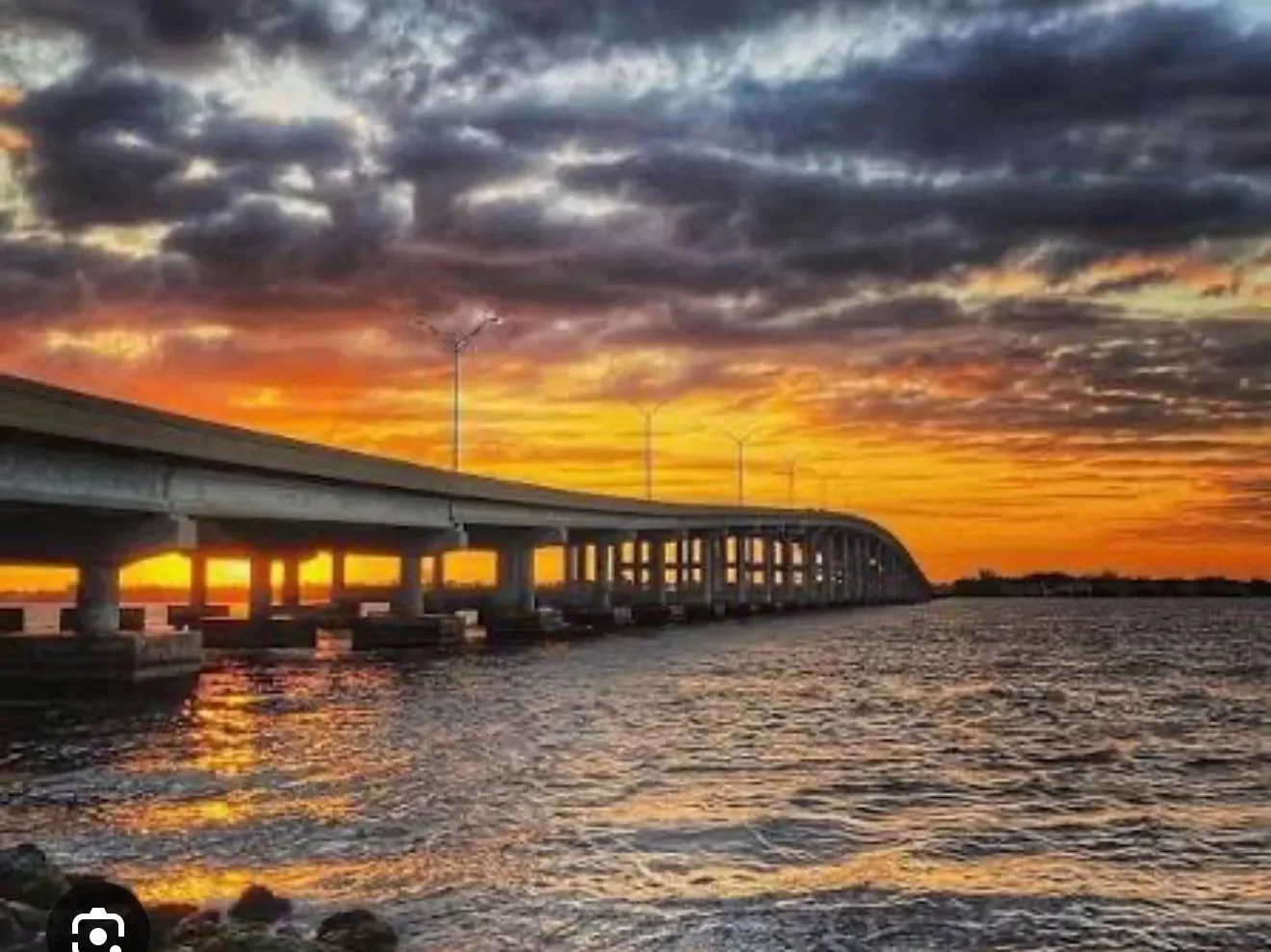 Sunset over a coastal bridge in Cape Coral, Florida